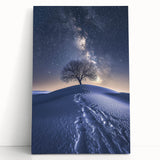 Desert landscape stretched canvas art featuring warm earthy tones and a serene sunset, leaning against a neutral wall, perfect for home decor.