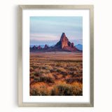 Framed landscape artwork depicting serene sand dunes in soft beige and gold tones, accented with a silver mat for an elegant finish, ideal for modern decor.