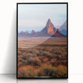 Framed acrylic artwork showcasing a serene desert landscape with golden dunes and a clear blue sky, presented in a sleek black frame for contemporary decor.
