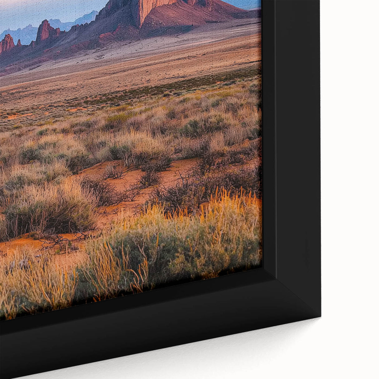 Close-up of a framed canvas depicting serene desert dunes in warm tones, showcasing intricate textures and shadows, perfect for enhancing modern home decor.