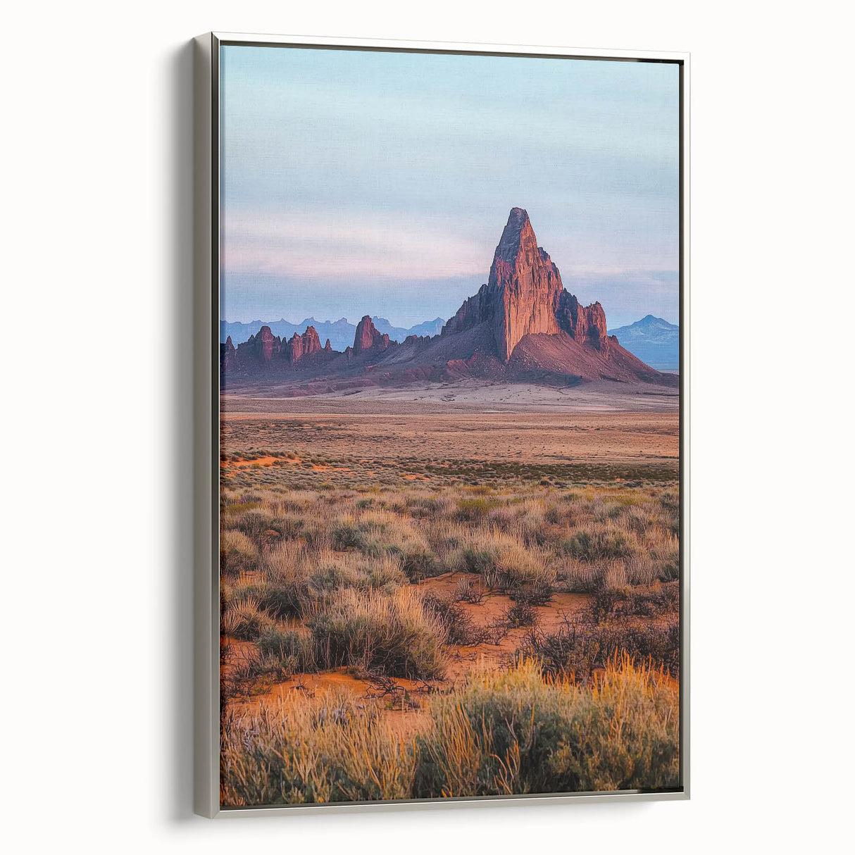 Framed canvas artwork showcasing serene sand dunes at sunset, featuring soft beige and golden hues with a sleek silver frame, perfect for modern decor.