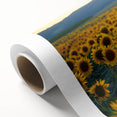 Vibrant rolled canvas featuring a serene landscape with lush green fields under a bright blue sky, elegantly packaged in a protective cardboard tube for shipping.