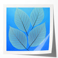 Close-up photo of green and yellow leaves on a glossy print, suited for art wall dining room or classy bathroom decor.