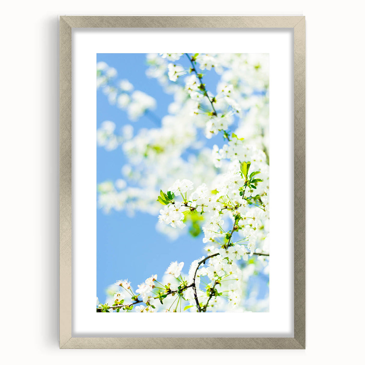 Textured abstract art print depicting spring, in pastel colors on a silver framed canvas, ideal for bedroom decor.