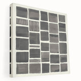 Abstract minimalist stretched canvas artwork showcasing soft pastel colors and geometric shapes, ideal for modern home decor. The piece is displayed from a side view, highlighting its depth and texture, making it a perfect accent for contemporary interiors.