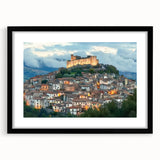 Framed landscape artwork showcasing a majestic castle scene under a vibrant sky, elegantly matted and presented in a sleek black frame, perfect for home decor.
