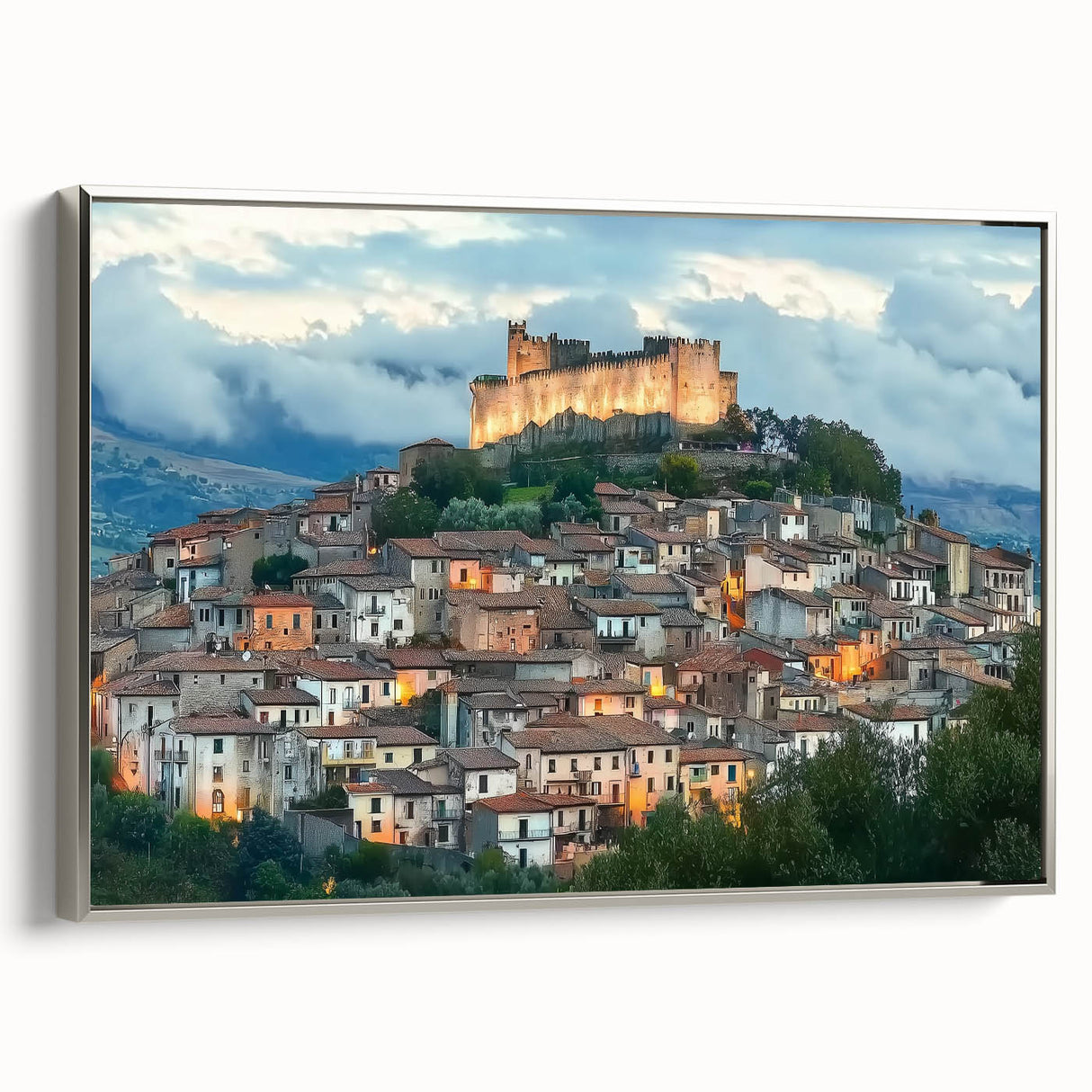 Framed canvas artwork of a picturesque landscape with a majestic castle, elegantly bordered in silver, showcasing vibrant colors and intricate details, ideal for home decor.