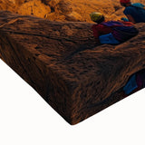 Close-up of a stretched canvas showcasing vibrant landscapes within cave formations, highlighting intricate textures and earthy color tones, perfect for home decor.