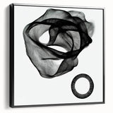 Abstract geometric framed canvas artwork showcasing bold black and white patterns, designed for modern decor. Ideal for enhancing contemporary living spaces or offices.