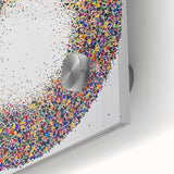 Close-up of a vibrant abstract acrylic glass artwork showcasing colorful splatters in various shades of blue, red, and yellow, perfect for modern home decor.