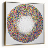 Framed canvas artwork showcasing an abstract design with silver and gold splatter patterns, adding a touch of modern elegance to any interior decor.