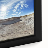 Close-up of a framed canvas print showcasing a vibrant landscape of canyons with rich colors and intricate details, perfect for enhancing home decor.