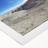 Vibrant landscape canvas print showcasing colorful canyons under a clear blue sky, rolled and ready for display, perfect for adding a stunning natural element to your decor.