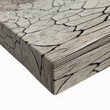 Close-up view of a stretched canvas depicting a vibrant landscape of canyons, showcasing rich earthy tones and intricate details, perfect for home decor.