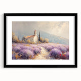 Black-framed landscape artwork featuring a serene countryside scene, highlighted by vibrant green fields and a clear blue sky, perfect for home decor.