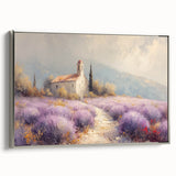 Framed canvas artwork depicting a serene countryside landscape, showcasing lush green fields and a clear blue sky, accented with a sleek silver frame. Ideal for home decor.