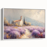 Framed canvas artwork showcasing a serene countryside landscape with lush green fields and trees, presented in a white frame, perfect for home decor.