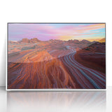 Framed acrylic landscape artwork depicting a serene desert scene with warm hues of orange and yellow, set in a sleek white frame, perfect for modern home decor.