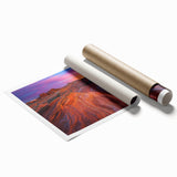 Desert landscape rolled print showcasing vibrant hues of orange and yellow under a clear blue sky, elegantly packaged in a protective cardboard tube for display.