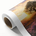 Vibrant rolled canvas artwork depicting a serene landscape with lush green fields and a clear blue sky, elegantly packaged in a durable cardboard tube for easy transport.
