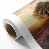Vibrant rolled canvas artwork depicting a serene landscape with lush green fields and a clear blue sky, elegantly packaged in a durable cardboard tube for easy transport.