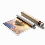 Vibrant rolled canvas depicting a serene landscape with lush green fields under a clear blue sky, elegantly packaged in a protective cardboard tube for shipping.