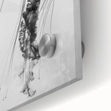 Large abstract wall art print depicting close-up water ripples in muted blue tones, printed on acrylic glass.