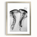 Textured art depicting abstract water ripples in muted blue and silver, framed in silver, ideal for modern bedroom decor.