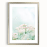 Textured art print featuring abstract swirls in soft green and white hues, silver-framed with mat, ideal for bedroom decor.