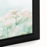 Close-up of a framed canvas depicting spring with vibrant, textured colors on a black background.