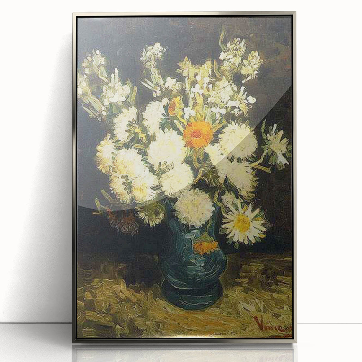 Large art print of Van Gogh's Starry Night in a silver frame, featuring swirling blue and yellow tones.