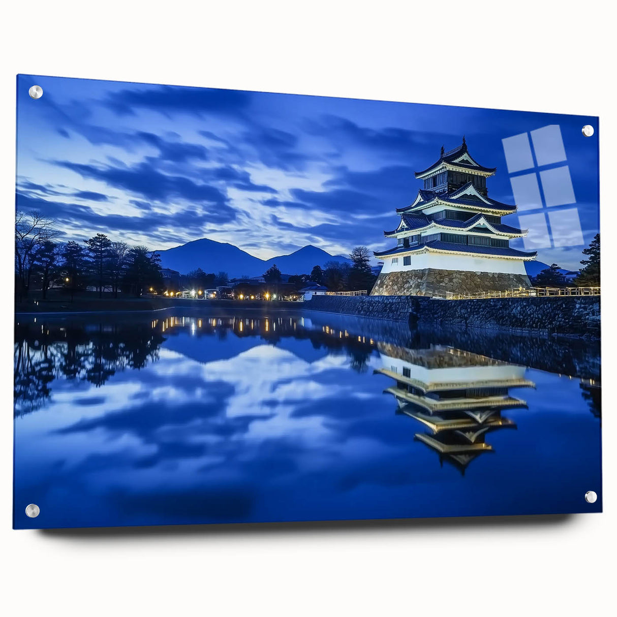 Acrylic glass artwork showcasing a stunning landscape with a medieval castle, displayed from a side view. The piece is elegantly pinned, highlighting its vibrant colors and intricate details, perfect for enhancing any home decor.