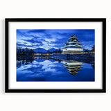 Elegant black-framed landscape artwork showcasing a majestic castle surrounded by lush greenery, ideal for enhancing home decor with a touch of sophistication.