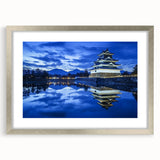 Framed landscape artwork featuring a castle design with a silver mat, showcasing intricate details against a scenic backdrop, ideal for home decor enhancements.