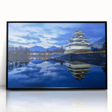 Framed acrylic artwork showcasing a stunning landscape of a medieval castle set against a vibrant sunset, featuring a sleek black frame for a modern touch.