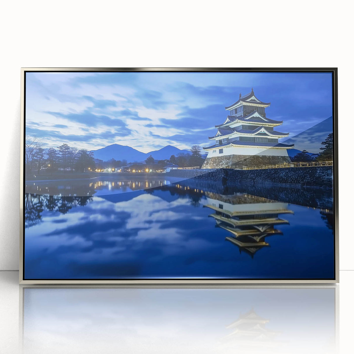 Framed acrylic artwork showcasing a picturesque landscape with a majestic castle, elegantly displayed in a silver frame, perfect for enhancing home decor.