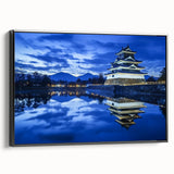 Framed canvas artwork depicting a scenic landscape with a majestic castle, presented in a sleek black frame, showcasing vibrant colors and intricate details. Ideal for enhancing home decor with a touch of elegance.