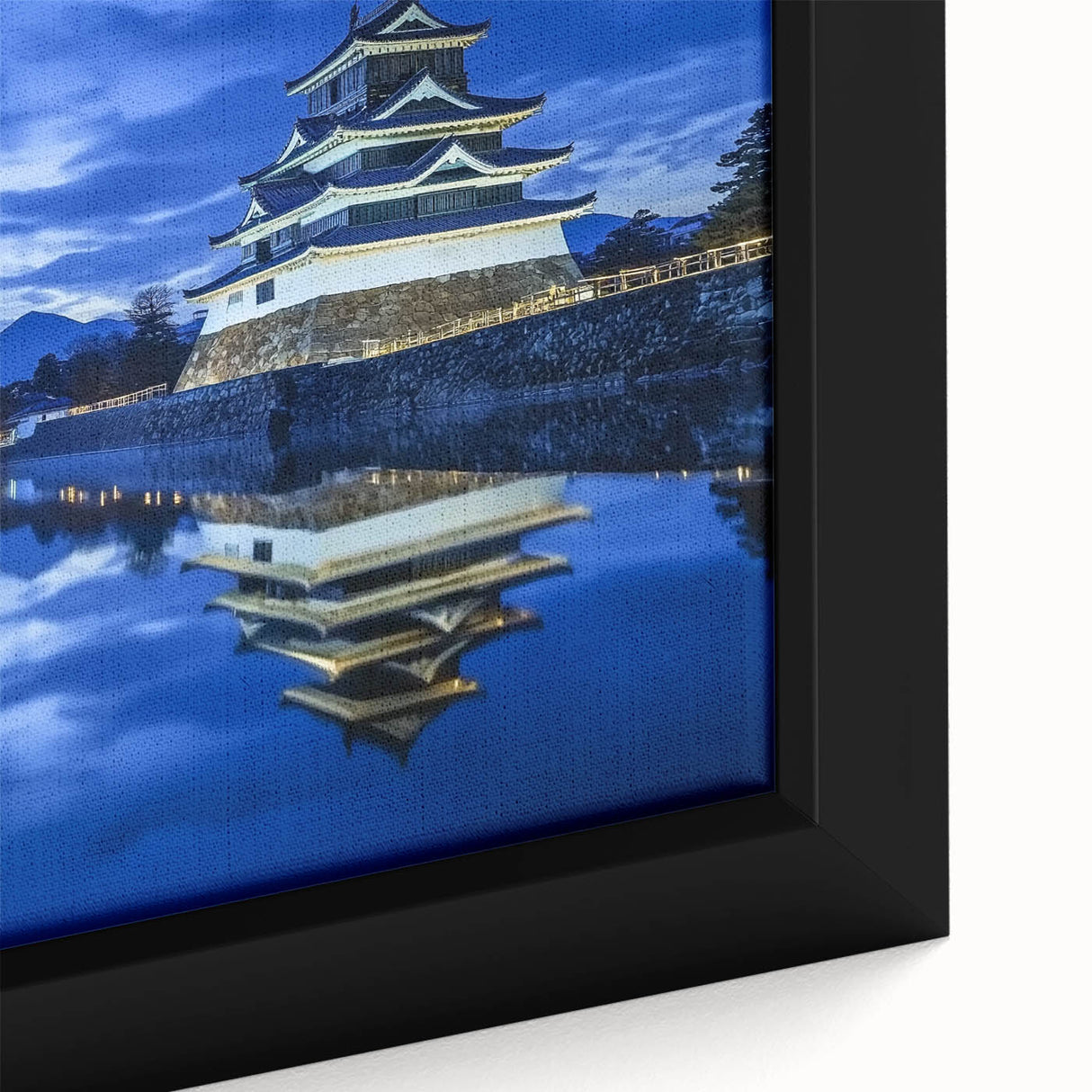 Close-up of a beautifully framed canvas print showcasing a serene landscape with a castle, featuring rich colors and intricate details, ideal for home decor.