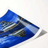 Scenic landscape canvas print featuring a majestic castle surrounded by lush greenery and blue skies, rolled for easy shipping in a protective tube. Perfect for home decor enthusiasts seeking a touch of elegance.