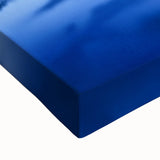 Stretched canvas artwork depicting a vibrant landscape with a majestic castle, showcasing rich colors and intricate details, perfect for home decor.