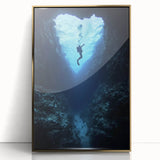 Framed acrylic artwork showcasing a stunning landscape with caves, featuring a gold border. This piece adds elegance and depth, perfect for modern decor.