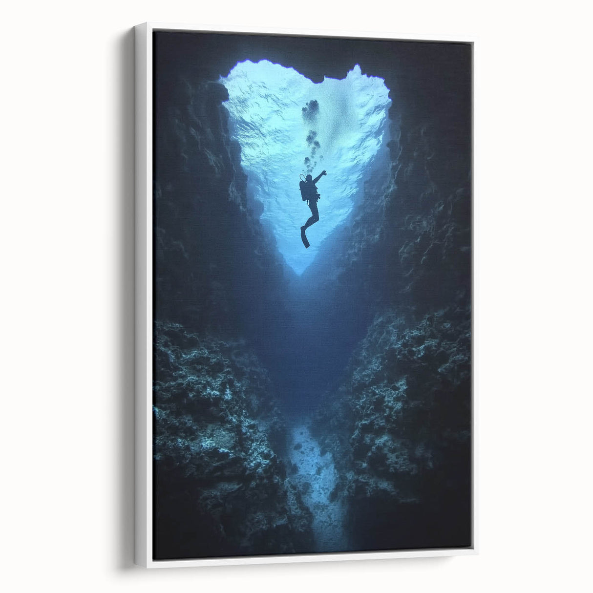 Framed canvas artwork showcasing a breathtaking landscape with intricate cave formations, presented in a sleek white frame, ideal for modern home decor.