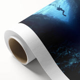 Rolled canvas depicting a vibrant landscape scene of caves and rock formations, showcasing intricate details and rich colors, packaged securely for delivery.