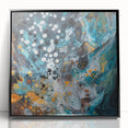 Framed abstract splatter artwork in vibrant colors, showcasing a modern aesthetic with a sleek black frame, ideal for contemporary interior decor.
