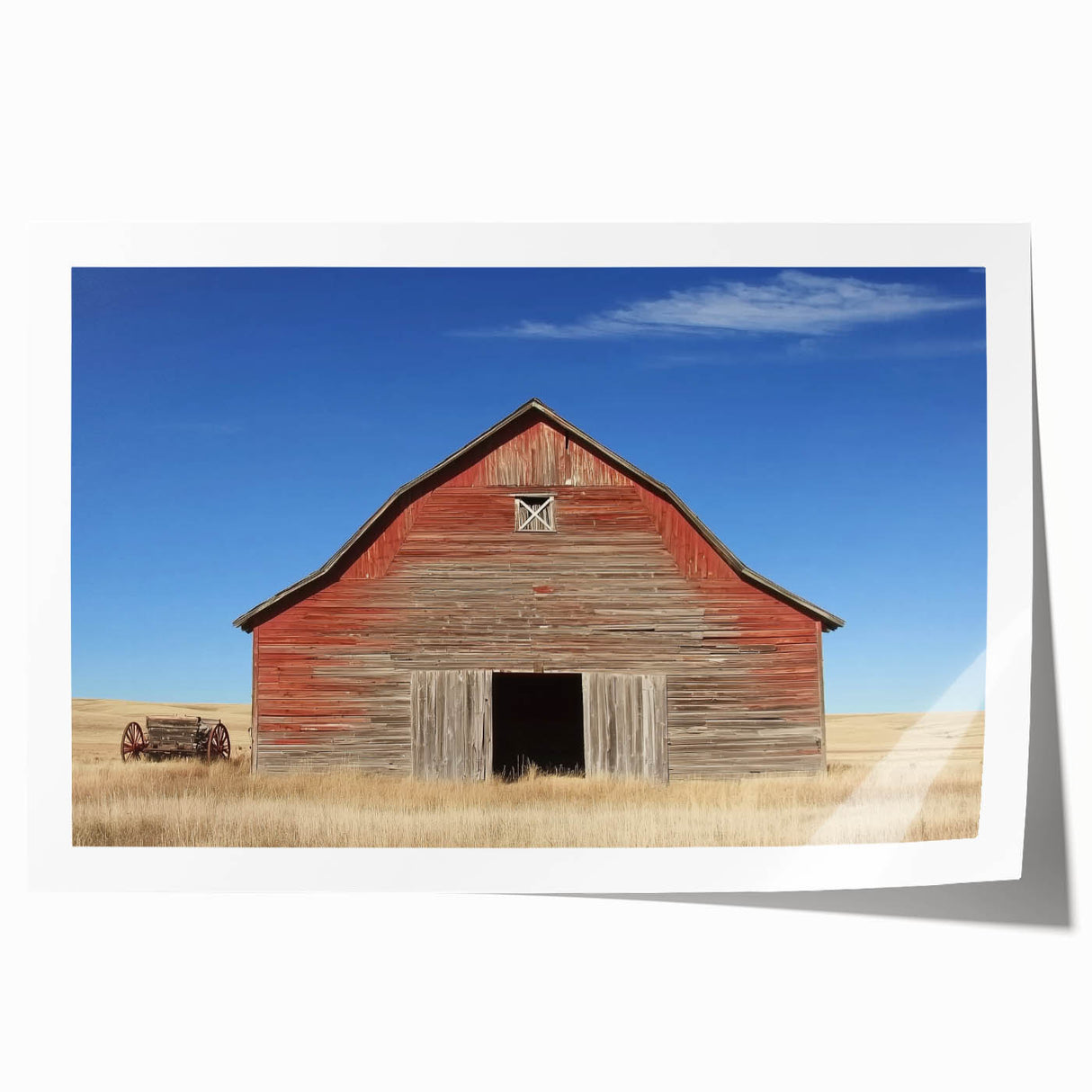 Rolled canvas print showcasing a serene landscape barn scene with vibrant colors, carefully packaged in a protective cardboard tube for safe delivery.