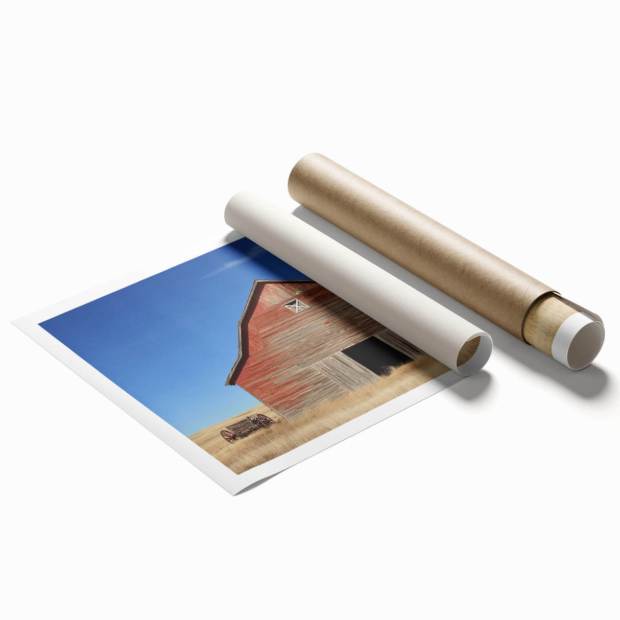 Rolled print showcasing a serene landscape of a rustic barn surrounded by lush greenery and vibrant sky, securely packaged in a protective cardboard tube for delivery.
