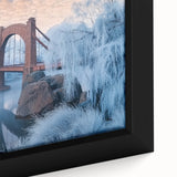 Close-up of a framed canvas artwork depicting a serene landscape bridge scene, featuring vibrant colors and intricate details, ideal for enhancing home decor.