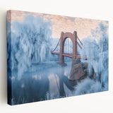 Stretched canvas artwork depicting a serene landscape view of a bridge surrounded by vibrant greenery and tranquil water, ideal for home decor enhancement.