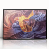 Framed acrylic landscape artwork showcasing vibrant canyons in rich earthy tones, featuring a sleek black frame that enhances the visual appeal, ideal for home decor.