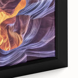 Close-up of a framed canvas artwork depicting vibrant canyons in a landscape scene, showcasing rich colors and intricate details, perfect for home decor.